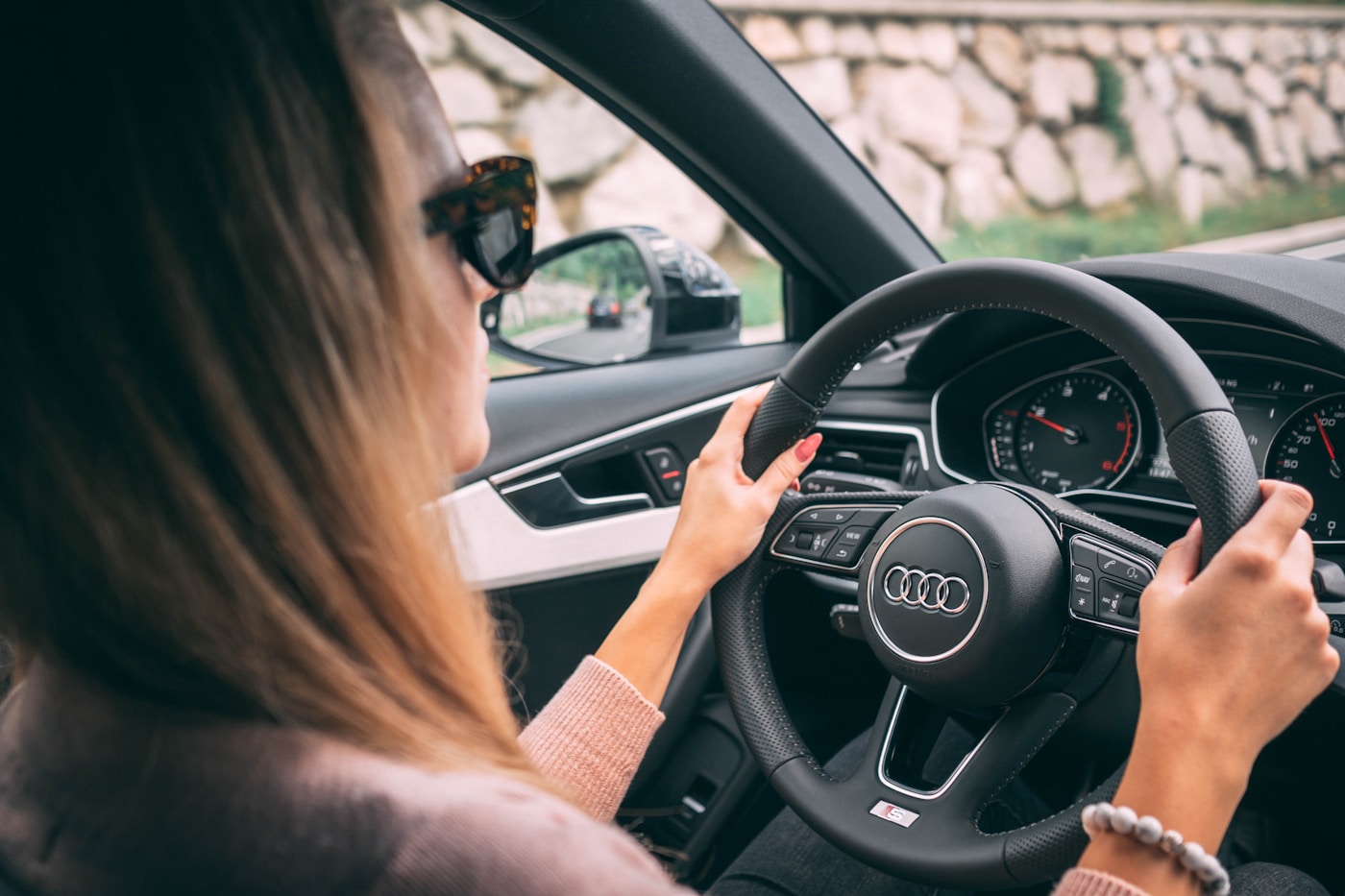 A person driving confidently with the road ahead