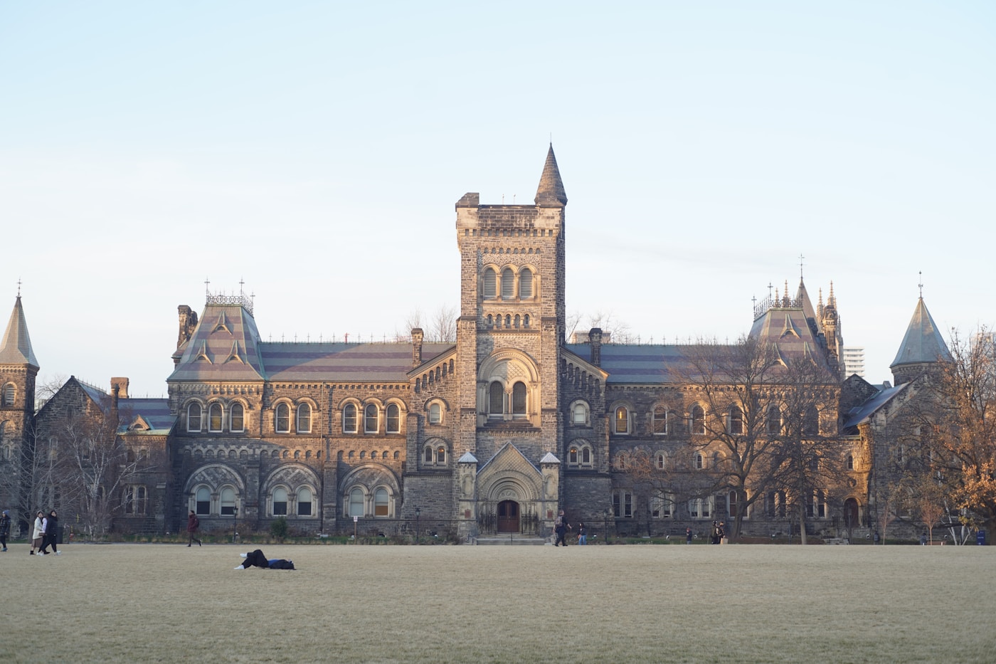 Students on the lawn in front of University College at the University of Toronto